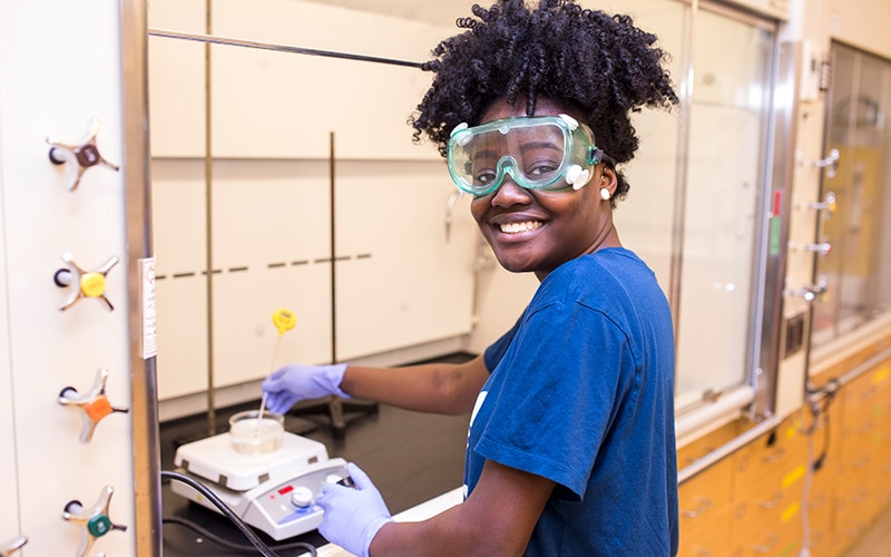 Beyond Benign student working in a lab