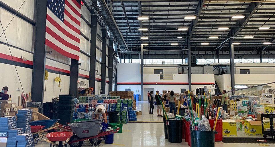 Dow's corporate aviation hangar serves as distribution center for flood relief supplies