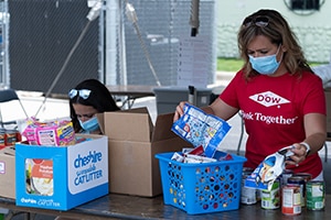 Dow volunteers sort donated relief supplies